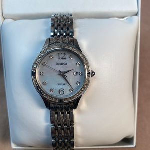 Ladies Seiko solar powered crystal embellished watch.